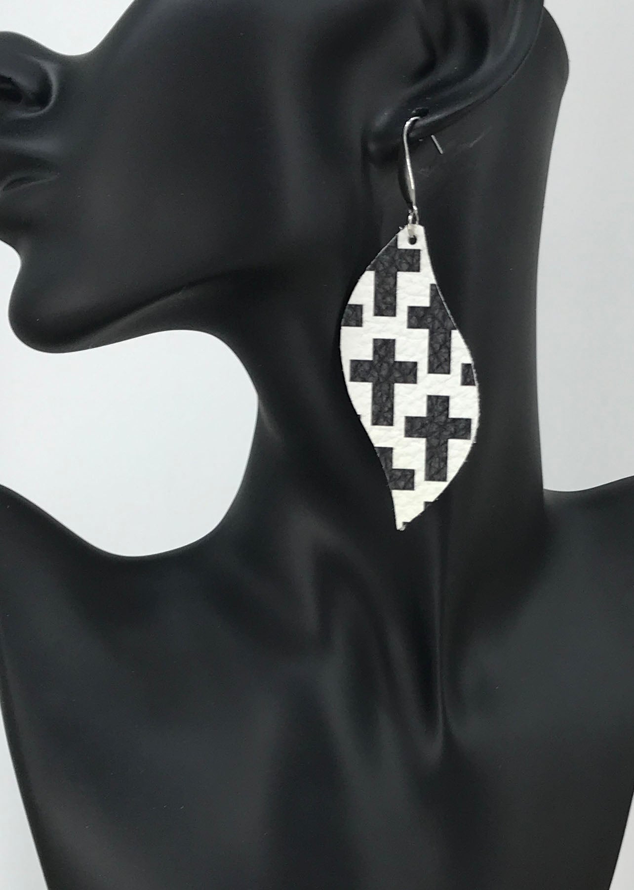 Black Cross Off White Curved Leaf Leather Earrings